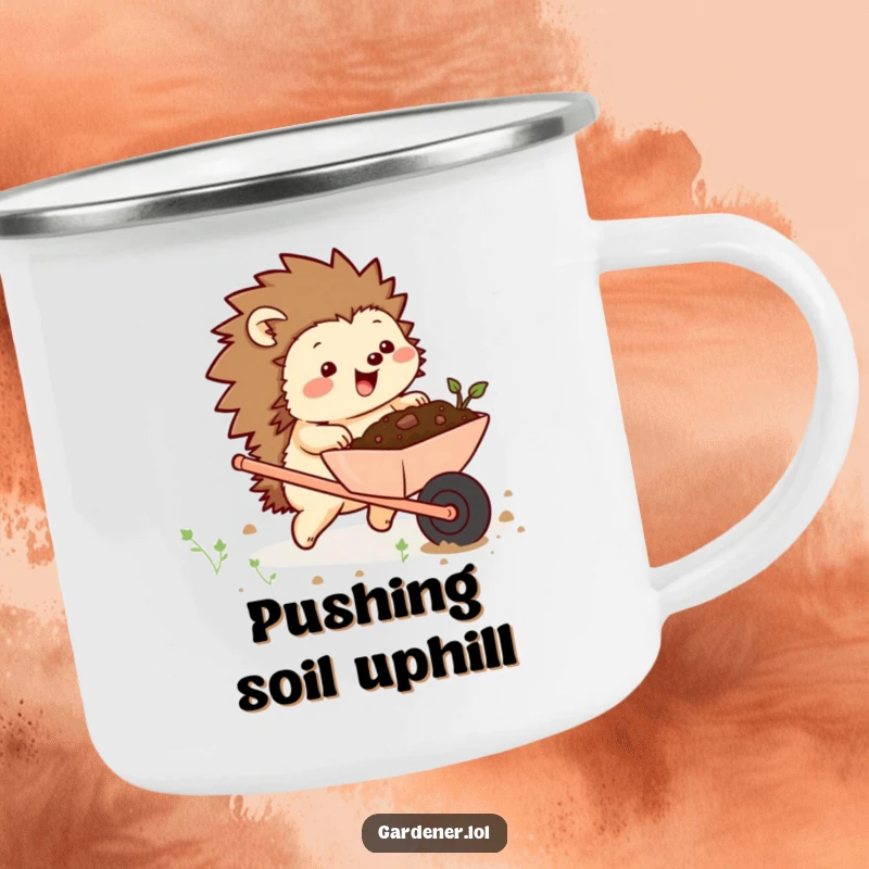 Funny camping mug showing a chubby hedgehog character excitedly pushing a wheelbarrow full of soil, perfect for outdoor adventures with garden humor.
