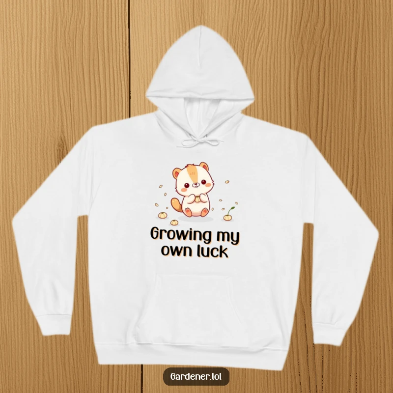 Funny Hoodie: Cute animal character playfully interacting with floating seeds, bringing a sense of gentle wonder.