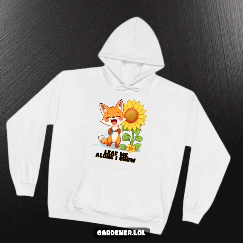 Funny hoodie illustrating an excited fox watering a colossal sunflower with intense glee, perfect for cozy, humorous wear.