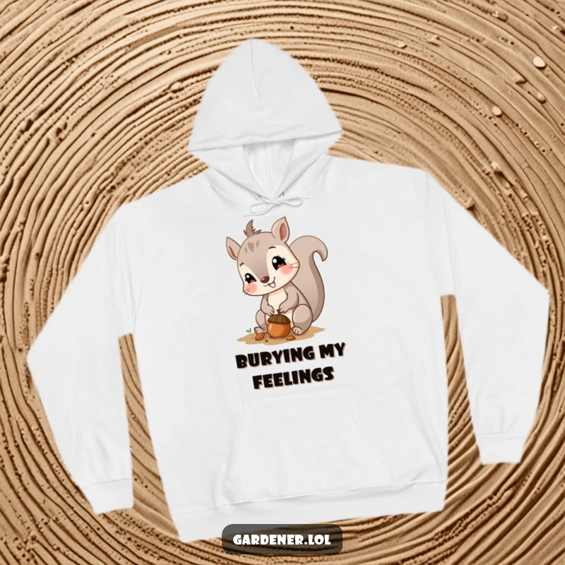 Funny hoodie featuring a curious, smiling squirrel planting a tiny acorn, perfect for cozy, humorous outdoor wear.