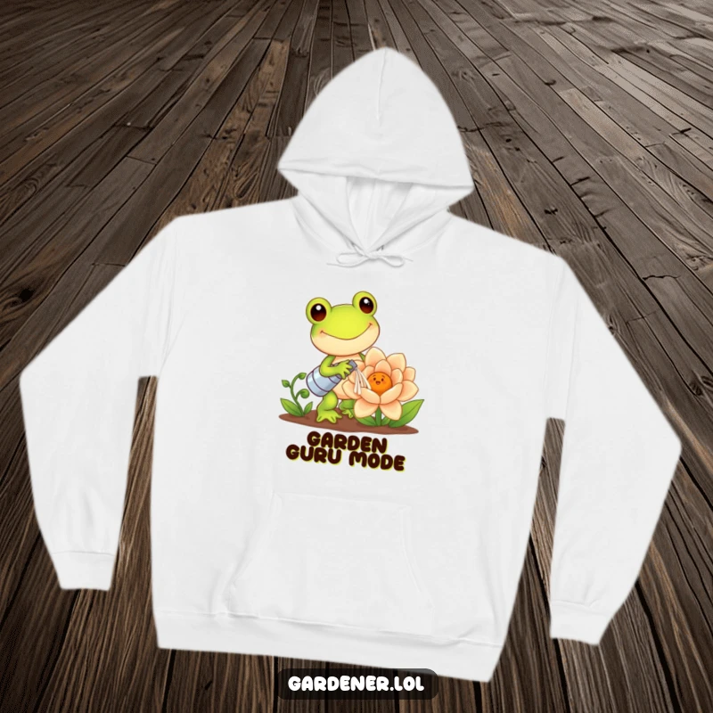 Funny Kawaii Frog Hoodie: Happy frog gardener waters a giant smiling flower, offering cozy comfort and a touch of cute humor, a perfect funny gift.