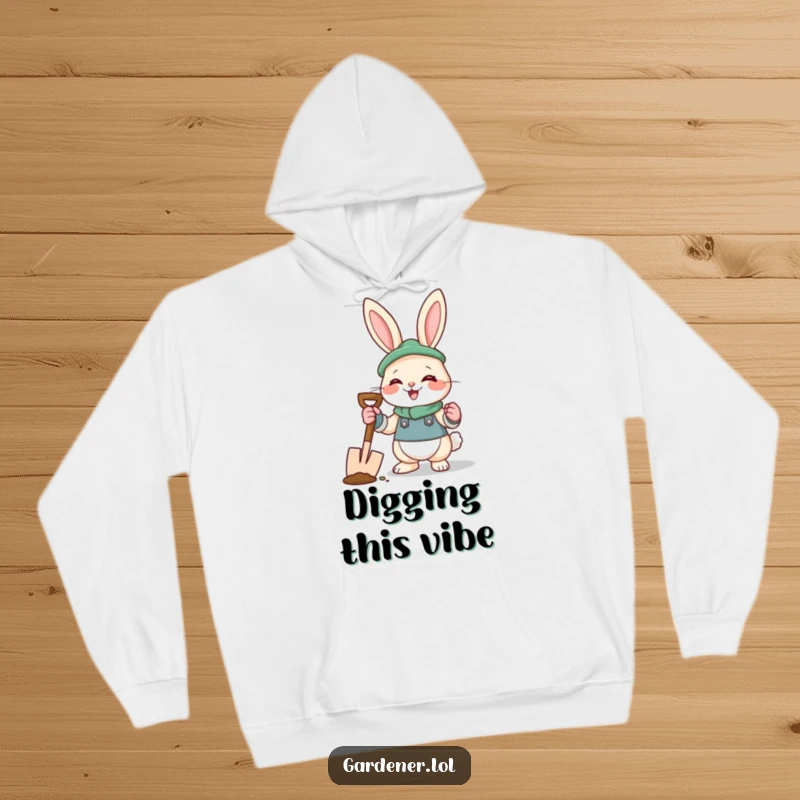 Funny rabbit gardener hoodie featuring a giggling bunny with gloves and a spade, ideal for cozy outdoor wear.