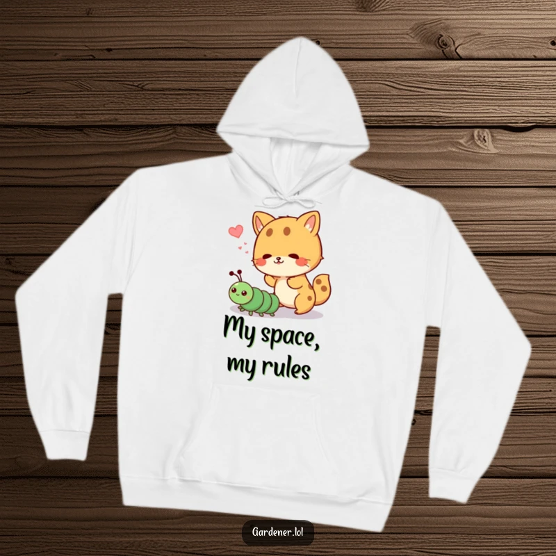 Funny hoodie depicting a cute animal hilariously shooing away a determined cartoon caterpillar, a scene of quirky wildlife interaction.