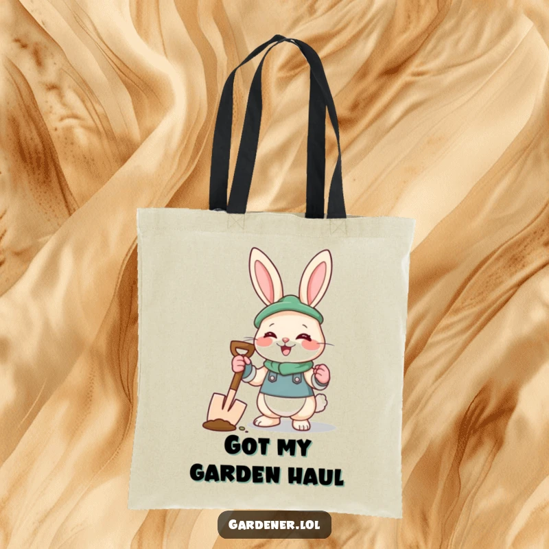 Funny rabbit gardener tote bag with a giggling bunny in gloves holding a spade, perfect for carrying garden supplies.